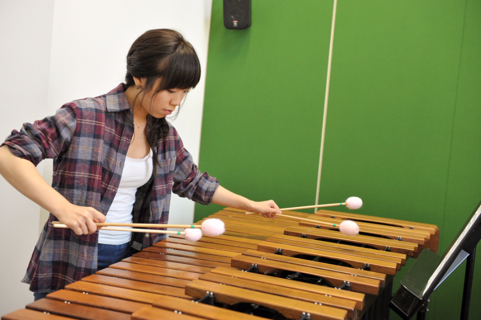 A student playing the marimba in the RCM's percussion suite
